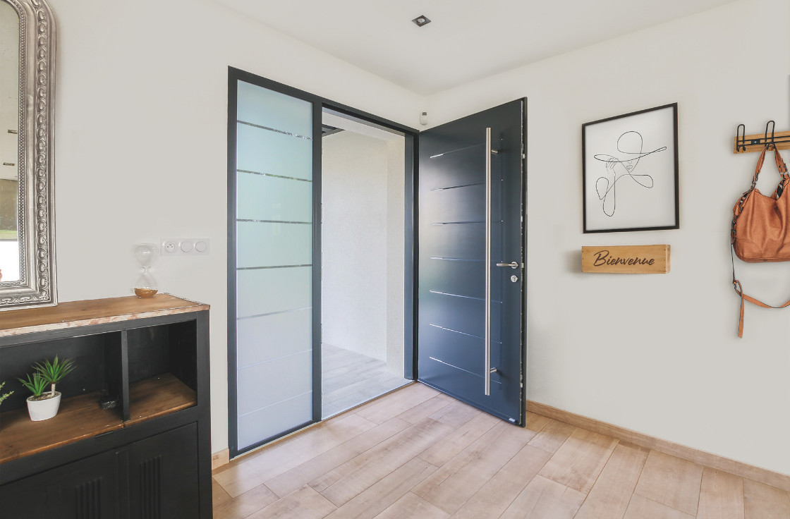 Porte d'entrée acier contemporaine avec inserts inox